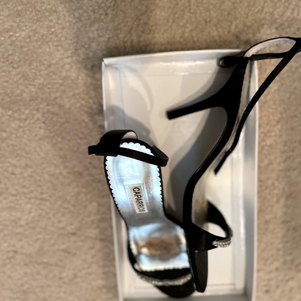 Strap on heels, worn a few times.  Like new